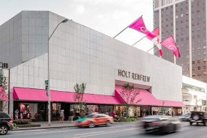 Holt Renfrew storefront with pink awnings and flags.